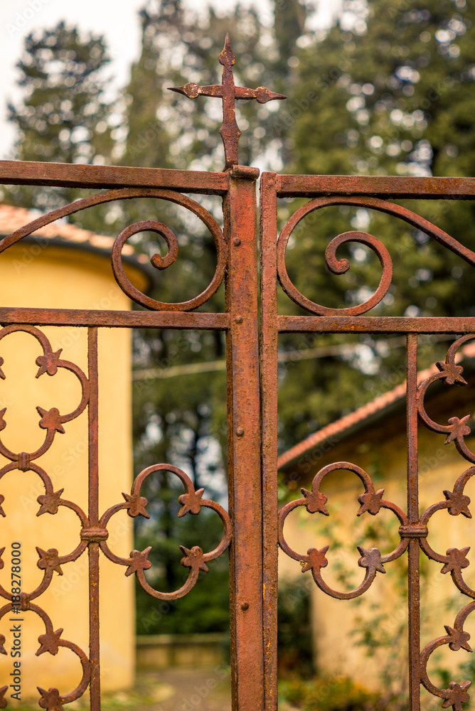 Old wrought iron gate of a church in a medieval village in Italy - 2 Old wrought iron gate of a church in a medieval village in Italy - 2