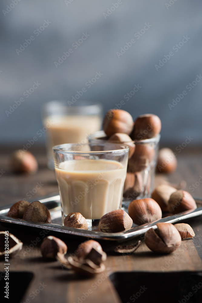Cream liqeuer with hazelnuts, homemade, selective focus, toned image Cream liqeuer with hazelnuts, homemade, selective focus, toned image