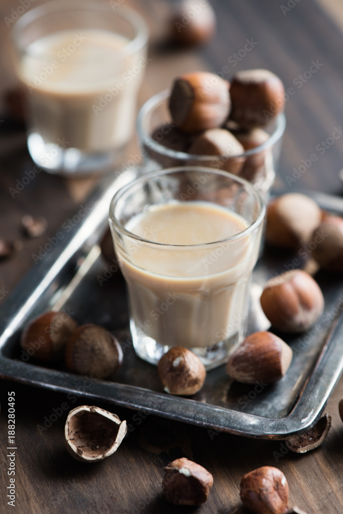 Cream liqeuer with hazelnuts, homemade, selective focus, toned image Cream liqeuer with hazelnuts, homemade, selective focus, toned image