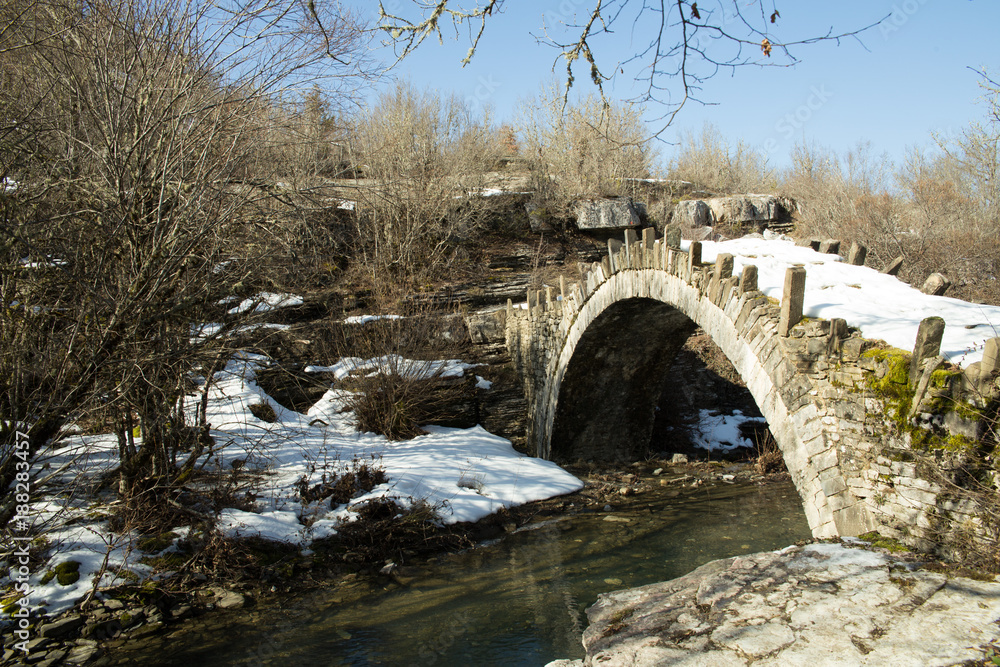 bridge old in Ioannina Zagori Greeece snow ice winter time bridge old in Ioannina Zagori Greeece snow ice winter time