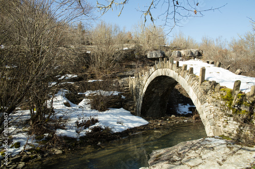 bridge old in Ioannina Zagori Greeece snow ice winter time © sea and sun