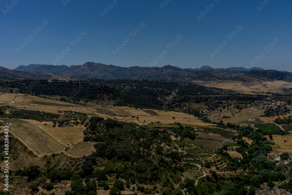 Greenery, Mountains, Farms and Fields on the outskirts of Ronda Spain, Europe on a hot summer day