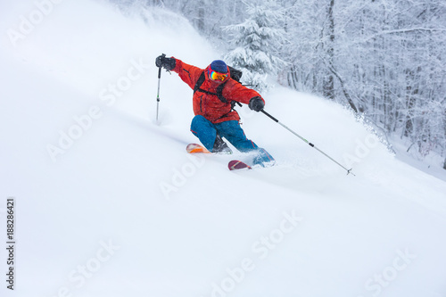 A skier is in the deep snow.