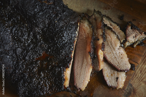 Close-up of smoked barbecue brisket on wooden surface