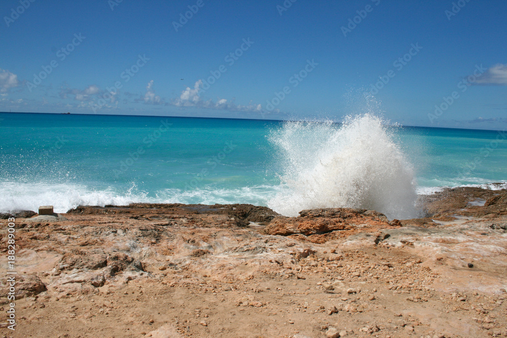 Waves crashing on the shoreline of St Martin