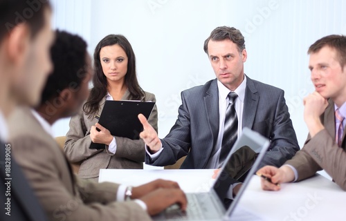 businessman holds working meeting with employees