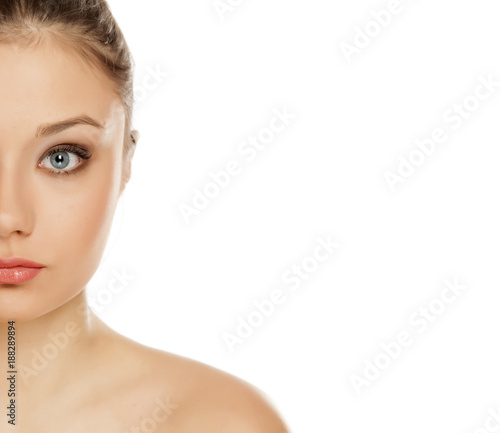 half portrait of young girl with makeup on white background