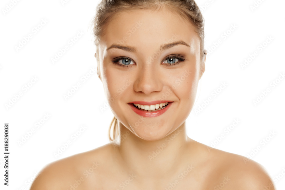 portrait of young happy girl with makeup on white background