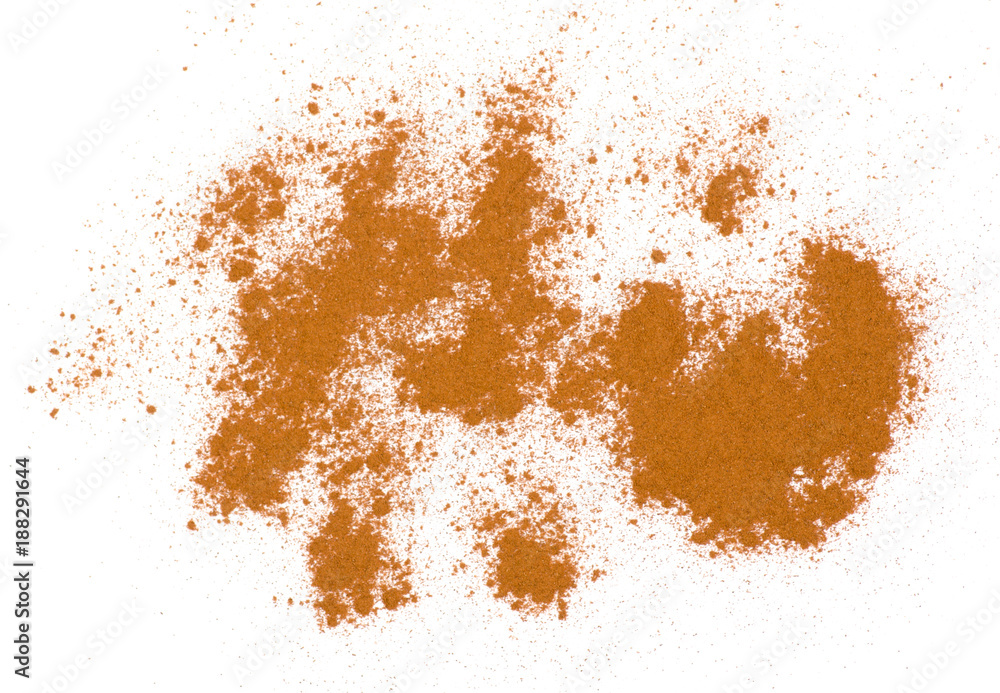 Pile of ground cinnamon on a white background