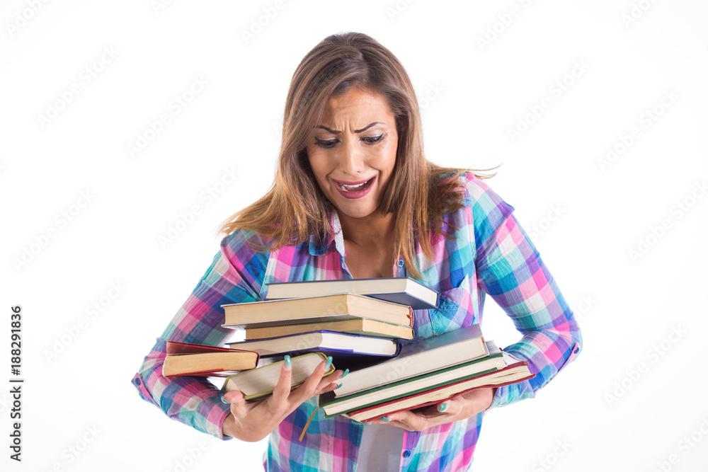 Beautiful female student carrying heavy books Beautiful female student carrying heavy books