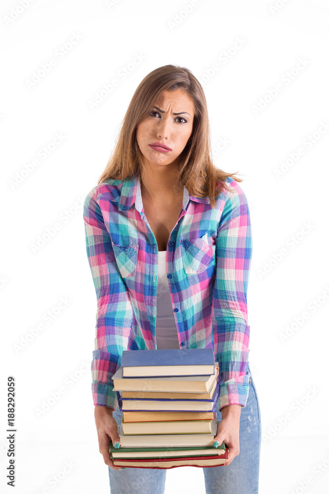 Beautiful female student carrying heavy books Beautiful female student carrying heavy books