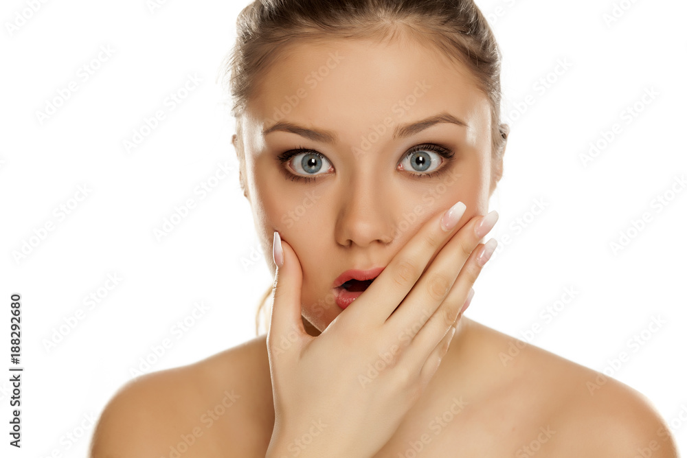 portrait of young shocked girl on white background portrait of young shocked girl on white background