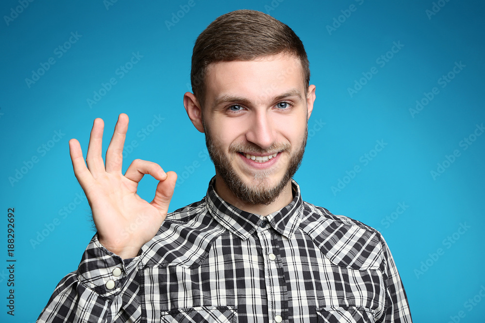 Portrait of young man on blue background Portrait of young man on blue background