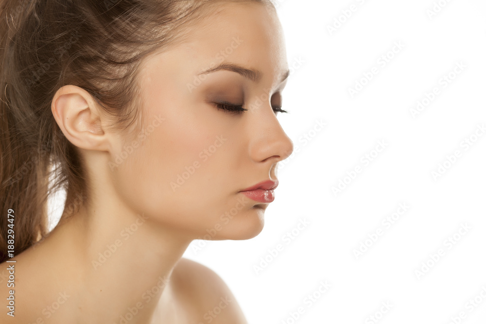 profile of young girl with closed eyes on white background profile of young girl with closed eyes on white background