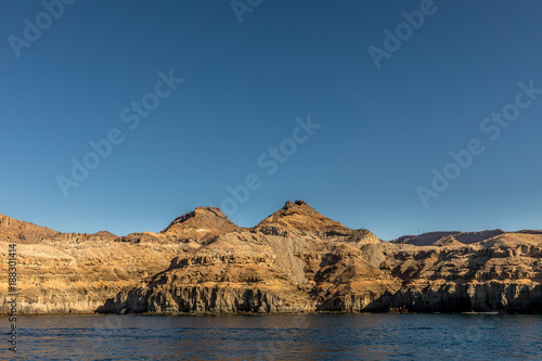 Gran Canaria, Canary Islands in Spain: The beautiful mountains at the coast between Puerto de Mogan and Puerto Rico. Layers of volcanic rock. Strata.