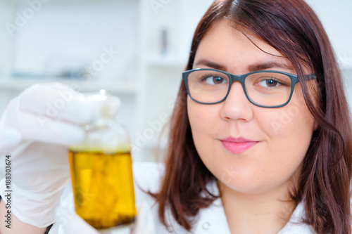 Girl teen in the laboratory of food quality tests..