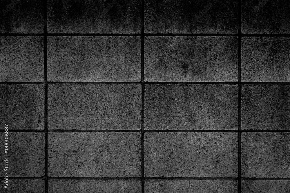Naklejka premium Black stone block wall seamless background and pattern texture