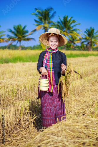 Wallpaper Mural farmer woman with tiffin carrier in rice field Torontodigital.ca