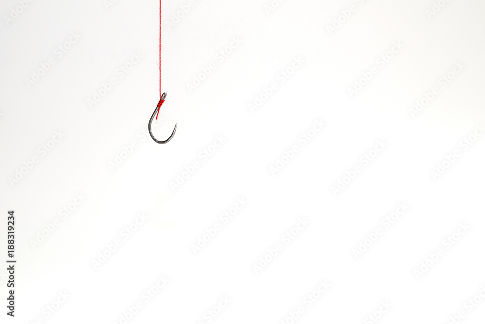 The hook is hanging with a red rope on a white background with e The hook is hanging with a red rope on a white background with e