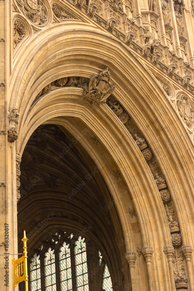 The architectural detail of the royal entrance below the Victoria Tower at the British Parliament building in London, England.