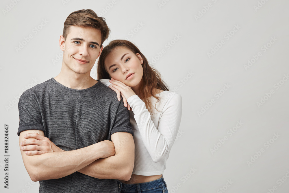Indoor photo of a couple who recently got moved in together. They made a serious step forward so girlfriend and boyfriend hope that romance between them will only become bigger and love stronger. Indoor photo of a couple who recently got moved in together. They made a serious step forward so girlfriend and boyfriend hope that romance between them will only become bigger and love stronger.