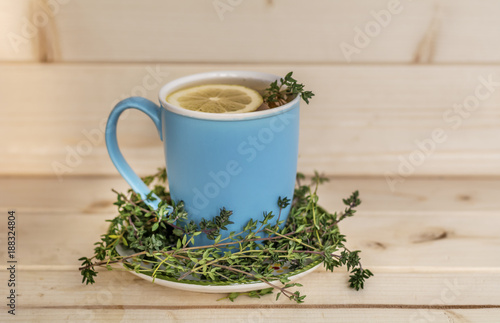 Blue Cup of Tea with Green Thyme Herb 
