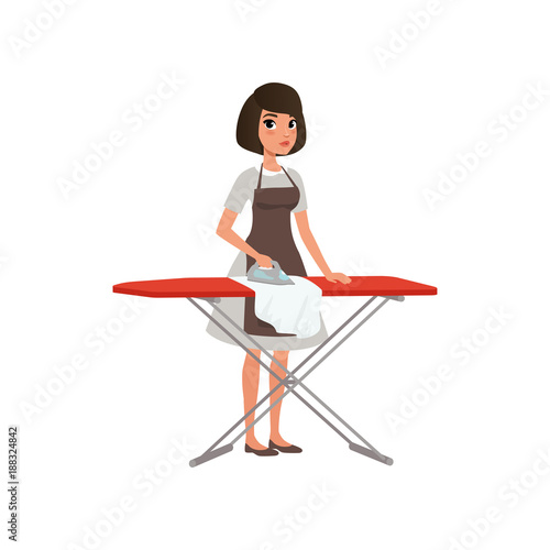 Brunette woman ironing clothes on an ironing board. Domestic worker. Maid service concept. Cartoon young girl in gray dress and brown apron. Flat vector design
