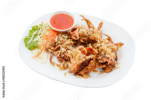 Soft Shell Crab fried with garlic on white plate and white background.