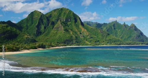 Cinematic aerial view of dramatic mountains and beautiful ocean on North Shore of Kauai photo