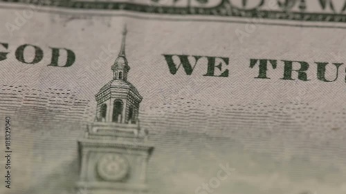 Panoramic macro shot of details of a one hundred-dollar bill. Back side with inscription: In God We Trust