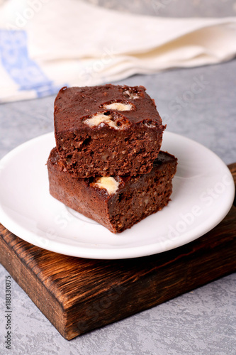 Homemade chocolate brownie on a white plate