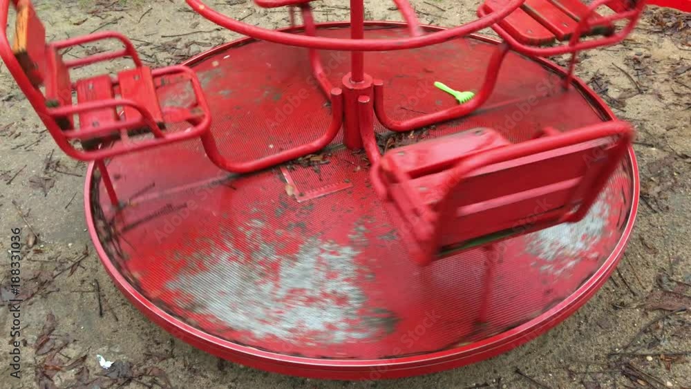 red swing spinning in the playground red swing spinning in the playground