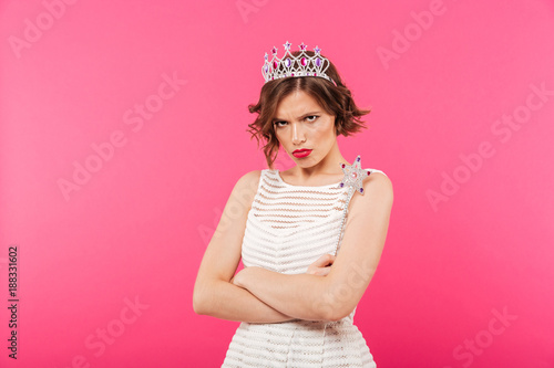 Portrait of an upset girl wearing crown
