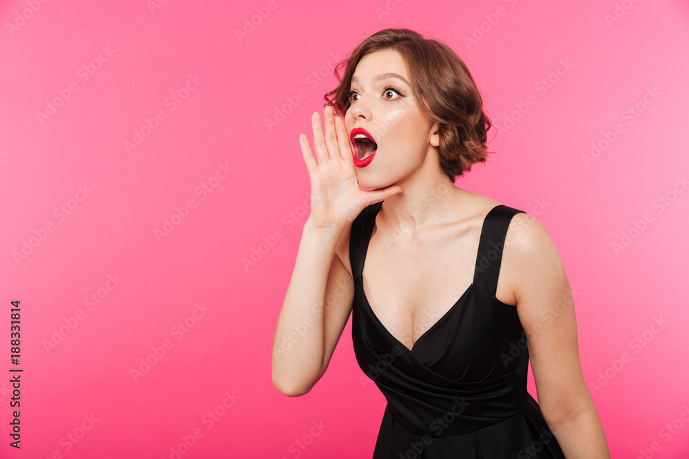Portrait of a surprised girl dressed in black dress Portrait of a surprised girl dressed in black dress