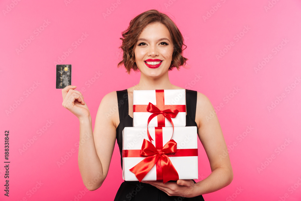 Fototapeta premium Portrait of a smiling girl dressed in black dress