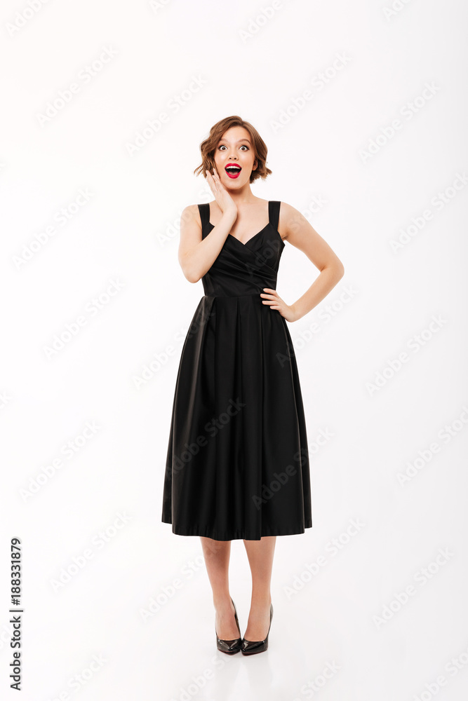 Full length portrait of a happy girl dressed in dress