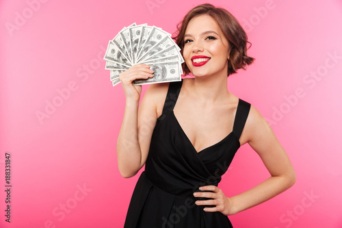 Portrait of a cheery girl dressed in black dress © Drobot Dean