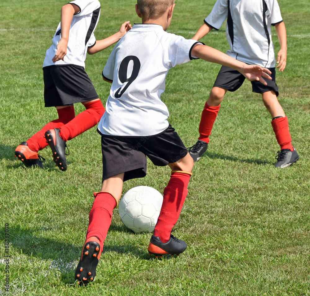 Kids are playing soccer outdoor Kids are playing soccer outdoor