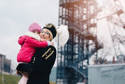 Working woman black coal miner with her child