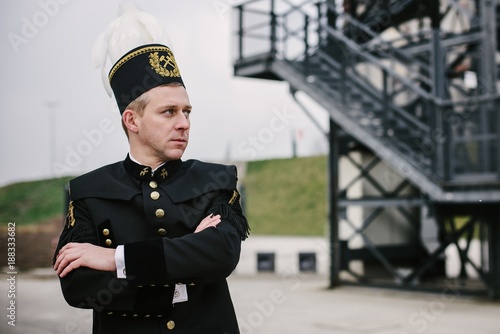 Man black coal miner in gala uniform