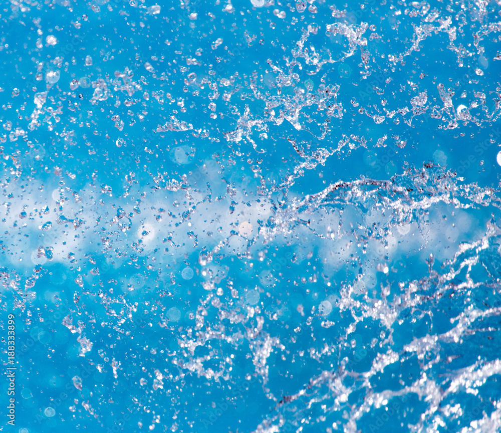 Splashes of blue water in the pool
