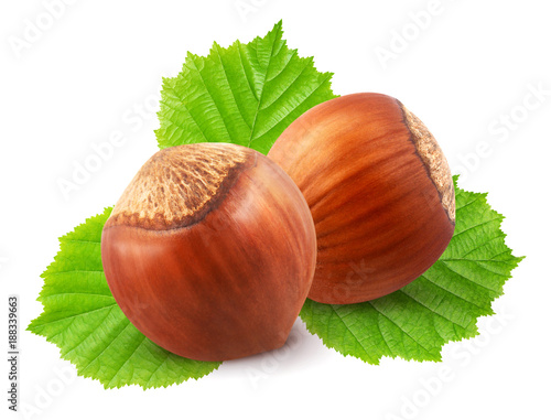 Hazelnuts with leaves isolated on white background.