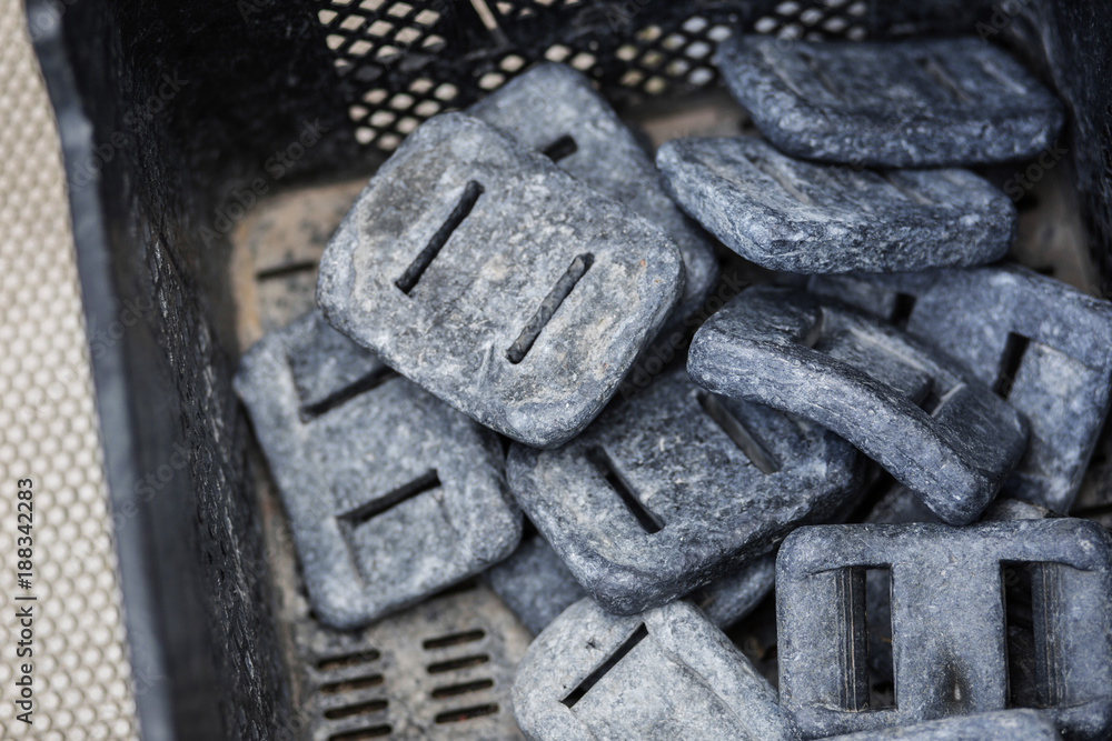 Lead scuba weights on a boat.