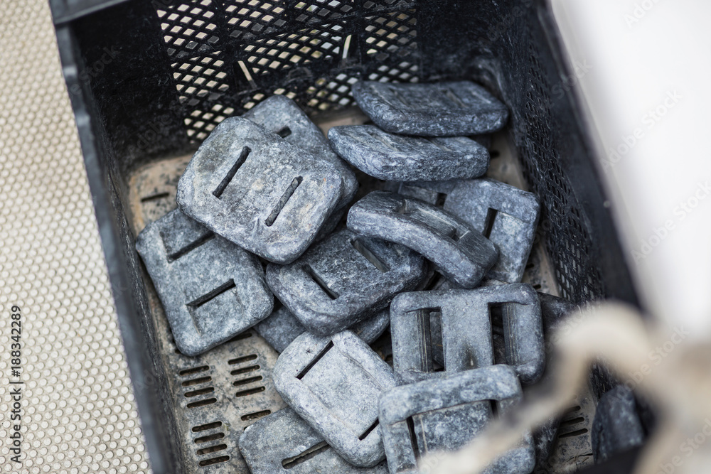 Lead scuba weights on a boat.