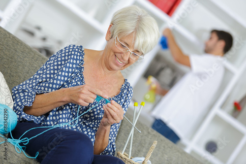 beautiful senior lady sewing photo