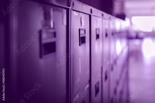 Filing cabinets in office building - violet color tone