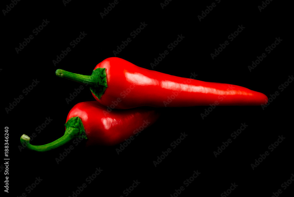 Red hot chili pepper isolated on black background cutout