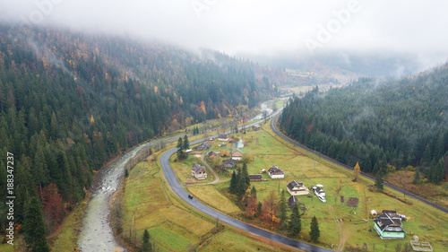 Aerial view of the middle of the mountains with road, railroad and river