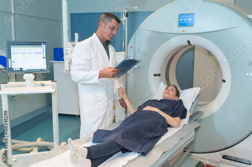 happy patient undergoing mri scan at hospital