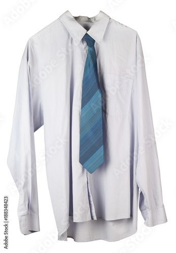 Old wrinkled washed-up man's shirt and tie is hanging on a hanger